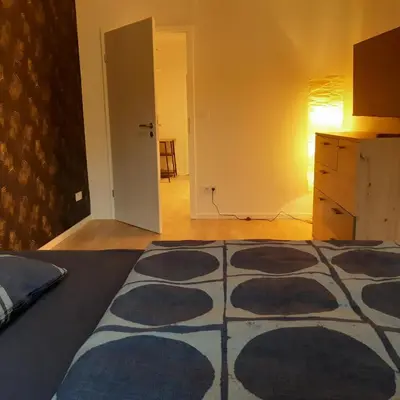 Ein Bett oder Betten in einem Zimmer der Unterkunft Ferienwohnung in Hohen Neuendorf bei Berlin, Zentral gelegen