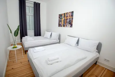 Ein Bett oder Betten in einem Zimmer der Unterkunft Wunderschön, hell und groß