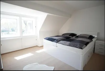 Ein Bett oder Betten in einem Zimmer der Unterkunft Haus am See