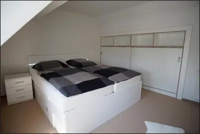 Ein Bett oder Betten in einem Zimmer der Unterkunft Haus am See