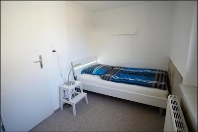 Ein Bett oder Betten in einem Zimmer der Unterkunft Haus am See