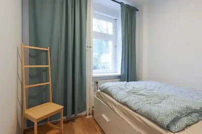 Ein Bett oder Betten in einem Zimmer der Unterkunft Neue 2-Zi-Apartment 15 Min Entfernung zum HBF und Brandenburger Tor