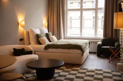 Ein Bett oder Betten in einem Zimmer der Unterkunft The Charming by Curt Suites