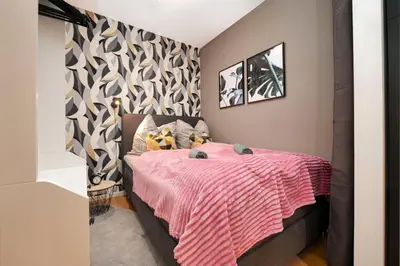 Ein Bett oder Betten in einem Zimmer der Unterkunft Blue Chili 33 - Modernes & gemütliches Business Apartment am Airport BER
