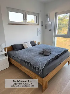 Ein Bett oder Betten in einem Zimmer der Unterkunft Moderne Doppelhaushälfte mit 3 SZ in der Nähe vom Scharmützelsee-seperat&naturnah