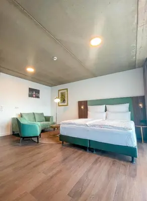 Ein Bett oder Betten in einem Zimmer der Unterkunft DX Apartments