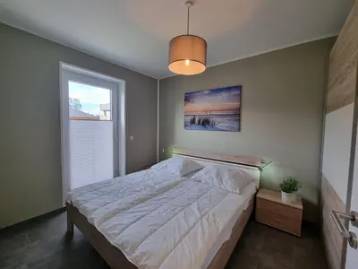 Ein Bett oder Betten in einem Zimmer der Unterkunft Park-Apartment Scharmützelsee Wohnung 1