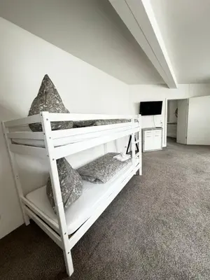 Ein Bett oder Betten in einem Zimmer der Unterkunft Haus Gitta - Stilvolle Stadtoase