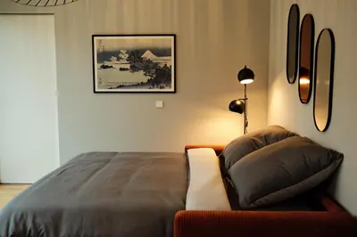 Ein Bett oder Betten in einem Zimmer der Unterkunft bluestar apartments am Storkower See inkl Badesteg und Gartensauna