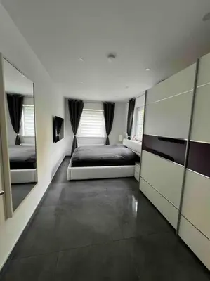 Ein Bett oder Betten in einem Zimmer der Unterkunft Schönes 2 Zimmer Apartment an der Stadt Grenze mit Klimaanlage
