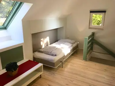 Ein Bett oder Betten in einem Zimmer der Unterkunft Ferienhaus am Wasser - citynah