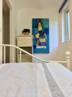 Ein Bett oder Betten in einem Zimmer der Unterkunft Ferienhaus am Wasser - citynah