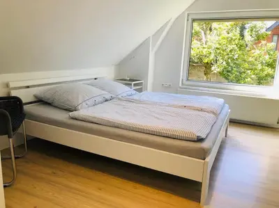 Ein Bett oder Betten in einem Zimmer der Unterkunft Ferienhaus am Wasser - citynah