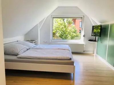 Ein Bett oder Betten in einem Zimmer der Unterkunft Ferienhaus am Wasser - citynah