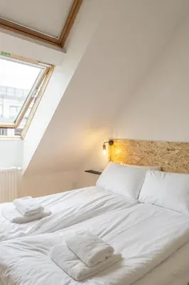 Ein Bett oder Betten in einem Zimmer der Unterkunft Mooeve Boxi Mid