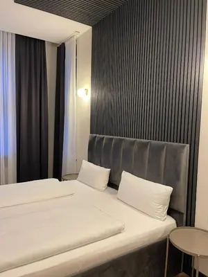Ein Bett oder Betten in einem Zimmer der Unterkunft Motel Blue Messe