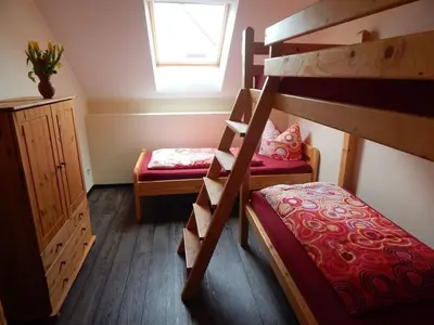 Ein Bett oder Betten in einem Zimmer der Unterkunft Pension + Apartments Tor zum Spreewald