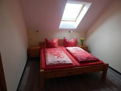 Ein Bett oder Betten in einem Zimmer der Unterkunft Pension + Apartments Tor zum Spreewald