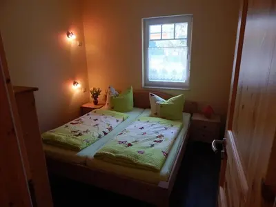 Ein Bett oder Betten in einem Zimmer der Unterkunft Pension + Apartments Tor zum Spreewald