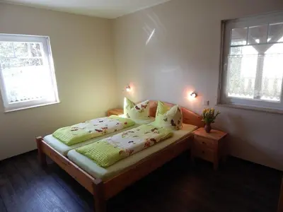 Ein Bett oder Betten in einem Zimmer der Unterkunft Pension + Apartments Tor zum Spreewald