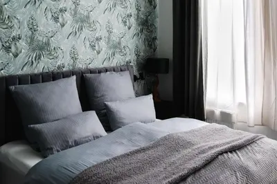 Ein Bett oder Betten in einem Zimmer der Unterkunft Exklusive Luxus-Unterkunft in Berlin Mitte: 2 Apartments, 130m², Designer-Möbel, Co2 neutrale Reinigung
