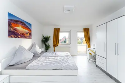 Ein Bett oder Betten in einem Zimmer der Unterkunft 5-Zimmer-Apartment nahe Müggelsee
