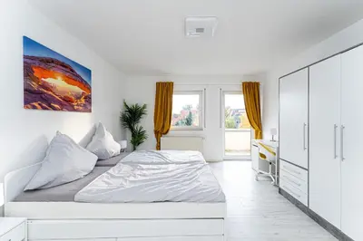 Ein Bett oder Betten in einem Zimmer der Unterkunft 5-Zimmer-Apartment nahe Müggelsee