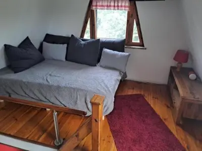 Ein Bett oder Betten in einem Zimmer der Unterkunft Finn Hütte Naturblick