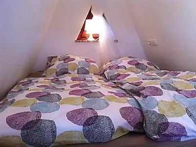 Ein Bett oder Betten in einem Zimmer der Unterkunft Finn Hütte Naturblick