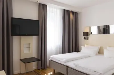 Ein Bett oder Betten in einem Zimmer der Unterkunft Scandic Berlin Kurfürstendamm