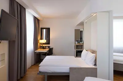 Ein Bett oder Betten in einem Zimmer der Unterkunft Scandic Berlin Kurfürstendamm
