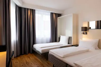 Ein Bett oder Betten in einem Zimmer der Unterkunft Scandic Berlin Kurfürstendamm