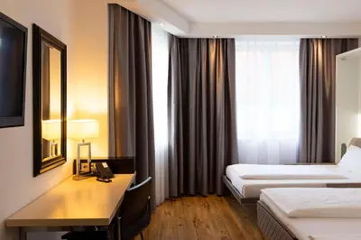 Ein Bett oder Betten in einem Zimmer der Unterkunft Scandic Berlin Kurfürstendamm