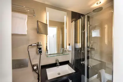 Ein Badezimmer in der Unterkunft Scandic Berlin Kurfürstendamm