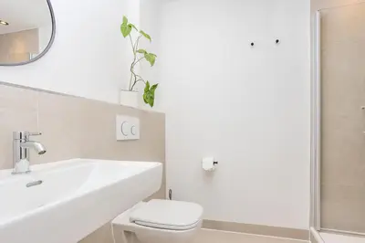 Ein Badezimmer in der Unterkunft Urban-Oasis: Zentral, Ruhig, Neu!