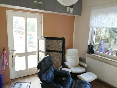 Ein Sitzbereich in der Unterkunft Ferienwohnung Puttenusenhof