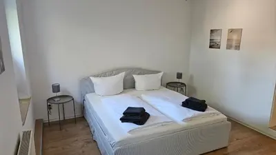 Ein Bett oder Betten in einem Zimmer der Unterkunft Zur Mühle