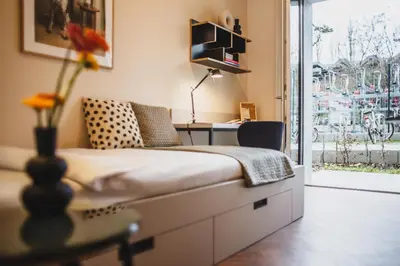 Ein Bett oder Betten in einem Zimmer der Unterkunft The Circus Living