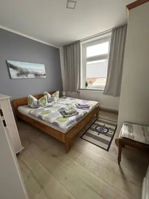 Ein Bett oder Betten in einem Zimmer der Unterkunft Ferienwohnung zur alten Waage