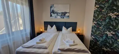 Ein Bett oder Betten in einem Zimmer der Unterkunft BusinessHotel Mühlenbeck