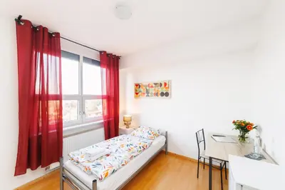 Ein Bett oder Betten in einem Zimmer der Unterkunft GASTEM UG