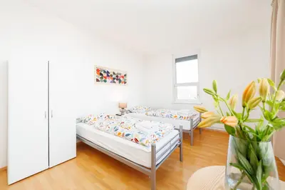 Ein Bett oder Betten in einem Zimmer der Unterkunft GASTEM UG