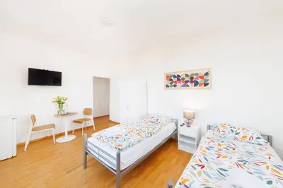Ein Bett oder Betten in einem Zimmer der Unterkunft GASTEM UG