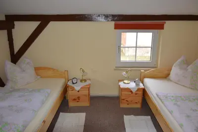 Ein Bett oder Betten in einem Zimmer der Unterkunft Ferienwohnung Siebmann