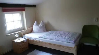 Ein Bett oder Betten in einem Zimmer der Unterkunft Ferienwohnung Siebmann