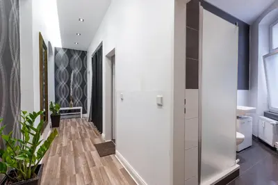 Ein Bett oder Betten in einem Zimmer der Unterkunft Dilo Apartments 160 sqm Modern Historic Apartments for 12 Guests