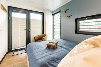 Ein Bett oder Betten in einem Zimmer der Unterkunft Hausboot Topas