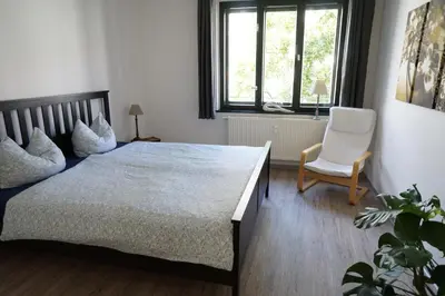 Ein Bett oder Betten in einem Zimmer der Unterkunft bluming inn - Ferienwohnung im Spreewald