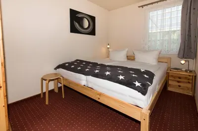 Ein Bett oder Betten in einem Zimmer der Unterkunft Ferienhaus Saturn