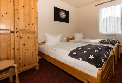 Ein Bett oder Betten in einem Zimmer der Unterkunft Ferienhaus Jupiter